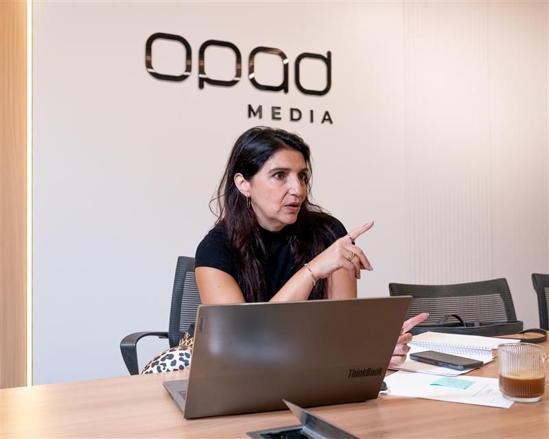 OpAD Media leadership presenting during an internal strategy meeting at NYC headquarters