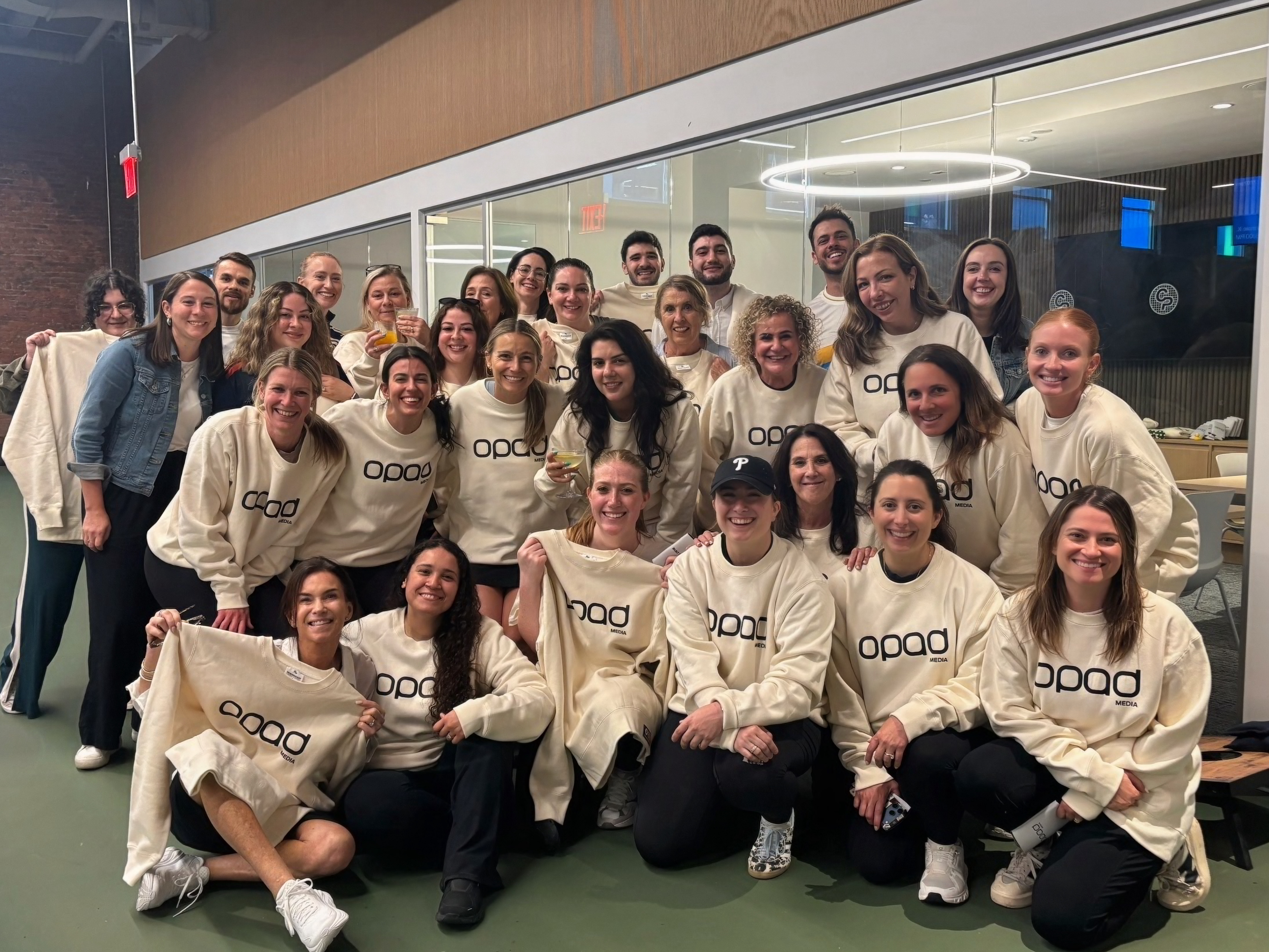 OpAD Media employees wearing high quality branded apparel at a company team event